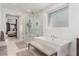 Stylish bathroom featuring a soaking tub, walk-in shower, and modern fixtures at 302 Watteau Ct, Henderson, NV 89012