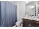 A modern bathroom with a shower and vanity offers a functional and stylish space for personal care and hygiene at 302 Watteau Ct, Henderson, NV 89012