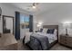Relaxing bedroom with a plush bed, large window, and ceiling fan at 302 Watteau Ct, Henderson, NV 89012