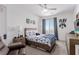 A bright bedroom with unique décor with blue accents is a comfortable space for relaxation and personalization at 302 Watteau Ct, Henderson, NV 89012