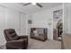 Bright bedroom featuring a comfortable chair, crib, ceiling fan and closet at 302 Watteau Ct, Henderson, NV 89012