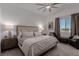 Inviting bedroom featuring neutral tones, cozy furnishings and large window at 302 Watteau Ct, Henderson, NV 89012