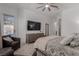 Serene bedroom with a ceiling fan, plush bed and cozy chairs at 302 Watteau Ct, Henderson, NV 89012