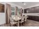 Dining room featuring a modern table and chairs with natural light streaming through windows at 302 Watteau Ct, Henderson, NV 89012