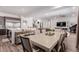 Open floor plan with dining area flowing into the kitchen and living room at 302 Watteau Ct, Henderson, NV 89012