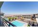 Modern home with a pool, backyard, and desert views provides an ideal space for outdoor entertainment and relaxation at 302 Watteau Ct, Henderson, NV 89012