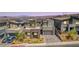 Modern home with desert landscaping, a two car garage and gray paint color at 302 Watteau Ct, Henderson, NV 89012