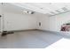 Spacious two car garage with epoxy floors and ample space for vehicle parking at 302 Watteau Ct, Henderson, NV 89012