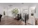 Bright upstairs hallway with wood floors, black metal railings, and decorative accents at 302 Watteau Ct, Henderson, NV 89012
