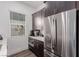Contemporary kitchen with stainless steel refrigerator and modern appliances is ideal for entertaining guests at 302 Watteau Ct, Henderson, NV 89012