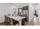 Modern kitchen with stainless steel appliances, breakfast bar, and sleek countertops is ideal for entertaining at 302 Watteau Ct, Henderson, NV 89012