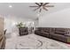 Upstairs living area with leather seating, an area for an office, and neutral decor at 302 Watteau Ct, Henderson, NV 89012