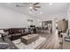 Spacious living room with hardwood floors flows into open kitchen with stainless steel appliances at 302 Watteau Ct, Henderson, NV 89012