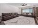 Spacious living room with large windows, plush seating, and ample natural light at 302 Watteau Ct, Henderson, NV 89012