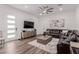 Comfortable living room features modern furnishings, hardwood floors, and an abundance of natural light at 302 Watteau Ct, Henderson, NV 89012