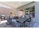 Covered outdoor area featuring ample seating and an outdoor cooking area, perfect for entertaining at 302 Watteau Ct, Henderson, NV 89012