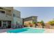 Backyard features a modern home and sparkling pool with an integrated automatic cover at 302 Watteau Ct, Henderson, NV 89012