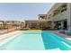 Beautiful backyard pool with a covered patio area with ample seating, perfect for outdoor entertaining at 302 Watteau Ct, Henderson, NV 89012