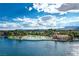 Aerial showcases lake with beach, palm trees, and well-maintained landscaping in a vibrant community at 3151 Soaring Gulls Dr # 2035, Las Vegas, NV 89128
