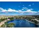 Scenic aerial view showcasing a waterfront community, lush greenery, and city skyline at 3151 Soaring Gulls Dr # 2035, Las Vegas, NV 89128