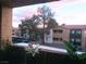Exterior balcony view of community with planters and artificial flowers at dusk at 3151 Soaring Gulls Dr # 2035, Las Vegas, NV 89128