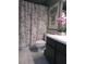 Bathroom featuring a floral shower curtain, sink, and modern amenities at 3151 Soaring Gulls Dr # 2035, Las Vegas, NV 89128