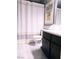 Modern bathroom features a white shower curtain with geometric details, stylish vanity, and tasteful decor at 3151 Soaring Gulls Dr # 2035, Las Vegas, NV 89128