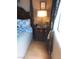 Cozy bedroom featuring a four-poster bed, classic lamps, and a decorative curtain near a sunny window at 3151 Soaring Gulls Dr # 2035, Las Vegas, NV 89128