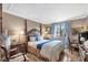 Comfortable bedroom with a four-poster bed, natural light, and charming, blue-themed décor at 3151 Soaring Gulls Dr # 2035, Las Vegas, NV 89128