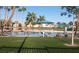 Lake view with lounge chairs and umbrellas on the grassy area of the Lake Las Vegas community at 3151 Soaring Gulls Dr # 2035, Las Vegas, NV 89128