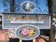 Charming community sign features a flower shop, garden center, and restaurant row with valet parking at 3151 Soaring Gulls Dr # 2035, Las Vegas, NV 89128