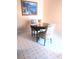 Cozy dining area featuring a round table, patterned chairs, and a scenic painting on the wall at 3151 Soaring Gulls Dr # 2035, Las Vegas, NV 89128