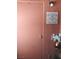 A quaint, salmon colored entrance with a decorative sign and floral arrangement creates a welcoming first impression at 3151 Soaring Gulls Dr # 2035, Las Vegas, NV 89128