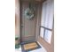Charming front door with wreath and welcome mat, offering a warm and inviting entrance at 3151 Soaring Gulls Dr # 2035, Las Vegas, NV 89128