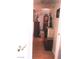 Hallway featuring warm-toned walls, hardwood floors, and elegant display cabinets at 3151 Soaring Gulls Dr # 2035, Las Vegas, NV 89128