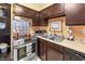 Efficient kitchen featuring stainless steel oven, practical storage, and stylish blue-and-white backsplash accents at 3151 Soaring Gulls Dr # 2035, Las Vegas, NV 89128