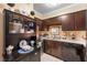 Well-appointed kitchen with essential appliances, dark wood cabinets, and charming decorative touches at 3151 Soaring Gulls Dr # 2035, Las Vegas, NV 89128