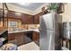 Functional kitchen features stainless steel appliances, ample cabinet space, and classic black and white flooring at 3151 Soaring Gulls Dr # 2035, Las Vegas, NV 89128