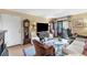 Inviting living room with hardwood floors, fireplace, balcony access, and traditional furnishings at 3151 Soaring Gulls Dr # 2035, Las Vegas, NV 89128