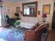 Comfortable living room features plush seating, a glass coffee table, and a large decorative mirror at 3151 Soaring Gulls Dr # 2035, Las Vegas, NV 89128