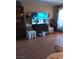 Living room featuring a large flat-screen television, comfortable seating, and ample natural light at 3151 Soaring Gulls Dr # 2035, Las Vegas, NV 89128