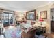 Cozy living room featuring a decorative rug, comfortable seating, and access to a private balcony at 3151 Soaring Gulls Dr # 2035, Las Vegas, NV 89128