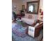 Cozy living room features a decorative rug, comfortable seating, and elegant decor at 3151 Soaring Gulls Dr # 2035, Las Vegas, NV 89128