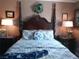 Beautifully decorated main bedroom featuring a four-poster bed, stylish lamps, and coordinated decor at 3151 Soaring Gulls Dr # 2035, Las Vegas, NV 89128