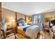 Elegantly furnished main bedroom with a four-poster bed, decorative accents, and a bright window at 3151 Soaring Gulls Dr # 2035, Las Vegas, NV 89128