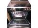Stainless steel oven with a glass top, digital display, and an open door to reveal the interior at 3151 Soaring Gulls Dr # 2035, Las Vegas, NV 89128