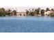 Scenic water view of a bridge over a tranquil lake with waterfront homes in the background at 3151 Soaring Gulls Dr # 2035, Las Vegas, NV 89128