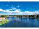 Beautiful lake view featuring lush landscaping and waterfront homes in a serene community at 3151 Soaring Gulls Dr # 2035, Las Vegas, NV 89128