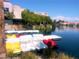 Picturesque waterfront featuring colorful paddle boats and a dock near a lakeside center at 3151 Soaring Gulls Dr # 2035, Las Vegas, NV 89128
