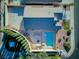 Aerial view showcasing a well-maintained property with a private pool, mature landscaping, and spacious outdoor areas at 3197 Castle Canyon Ave, Henderson, NV 89052